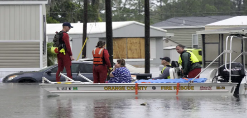Rescue teams in flooded areas helping people out of their homes, cars and stuck from the storm