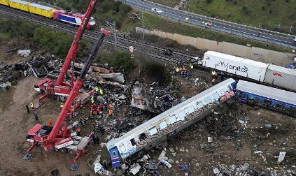 A picture of the Passenger train and the freight train’s Collison and emergency responders helping as much as they can.